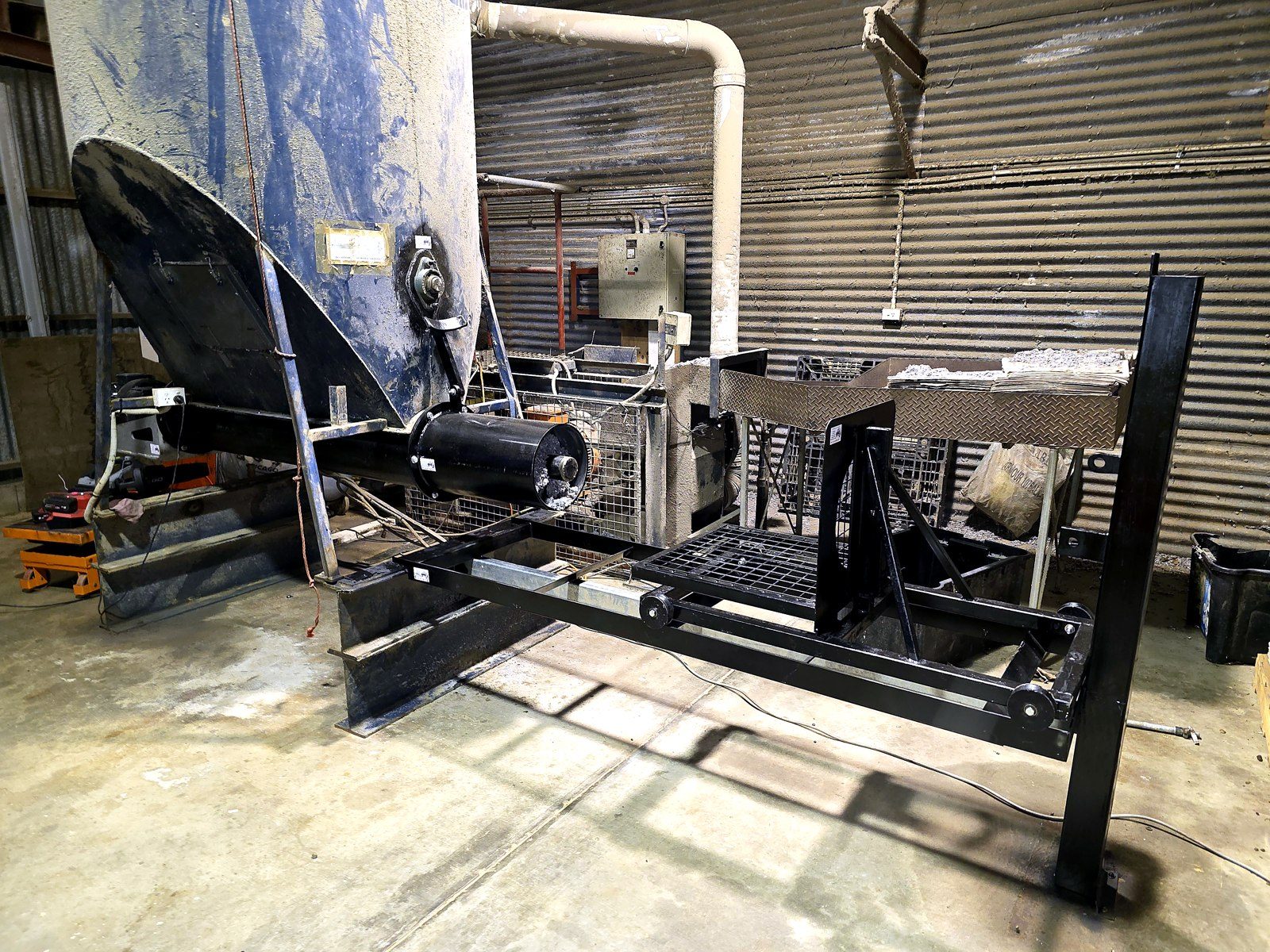 Steel processing frame and hopper under construction