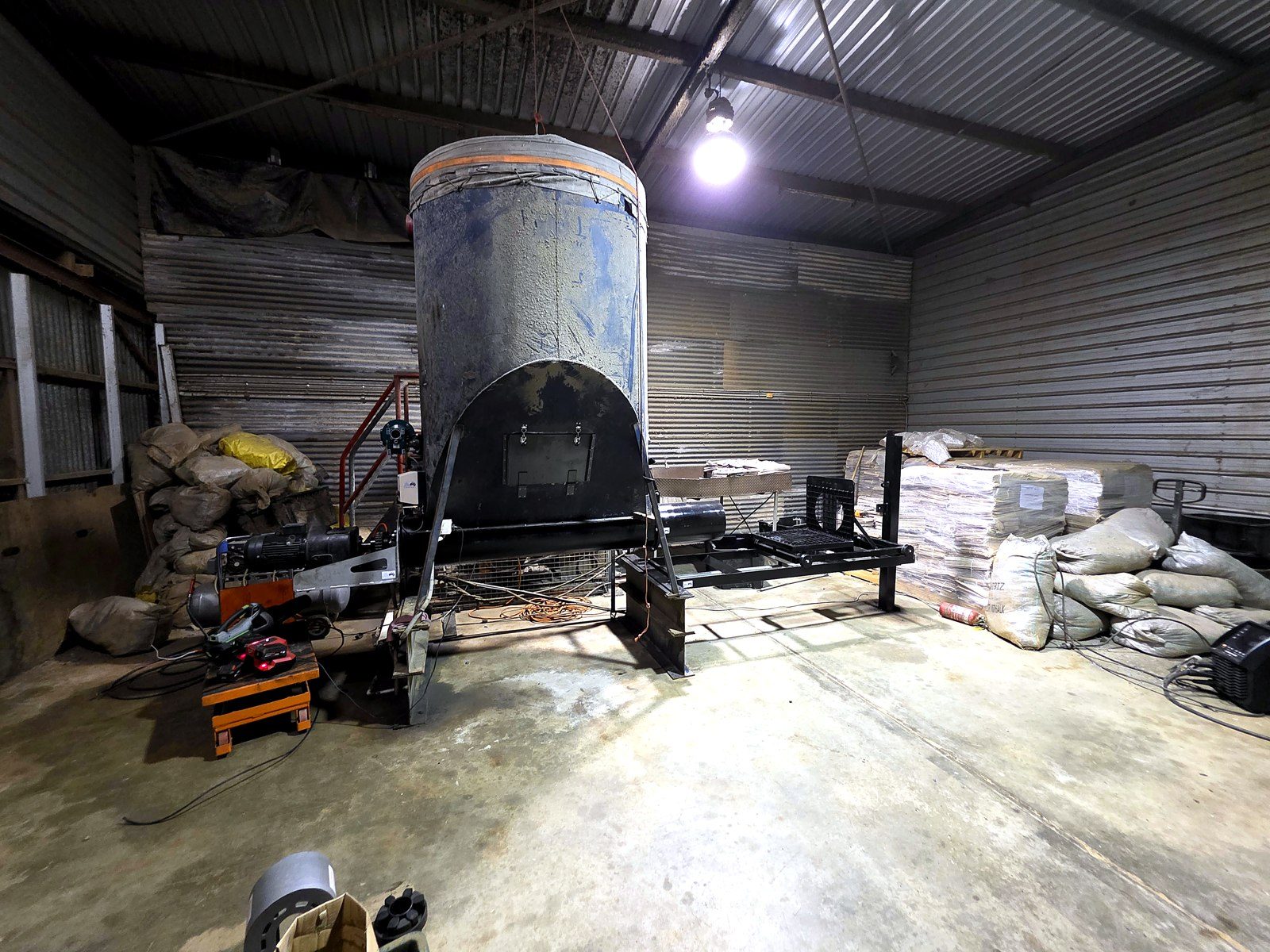 Fabricated hopper and frame assembly inside the paper processing plant